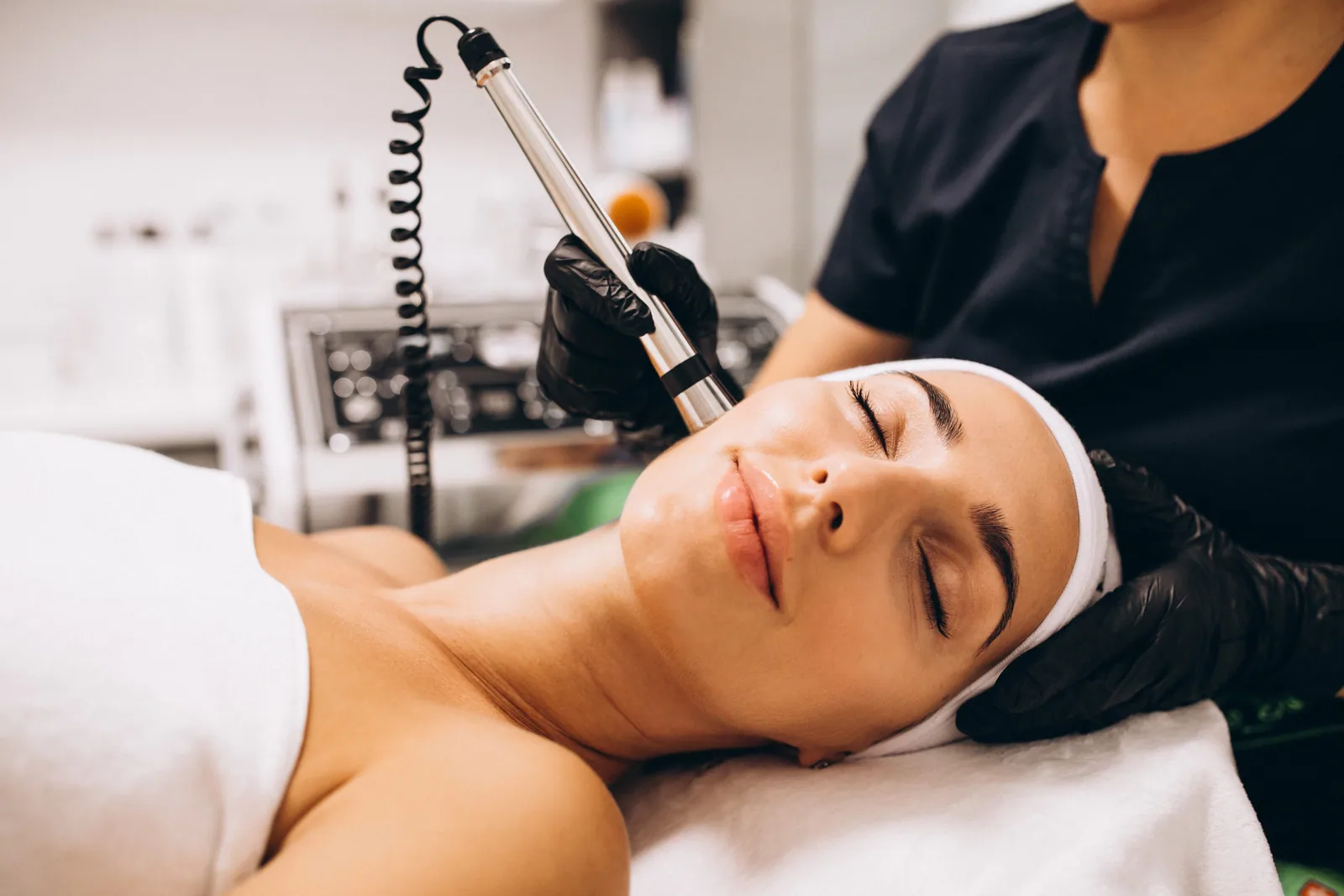 Carbon peel laser facial being performed in the treatment room