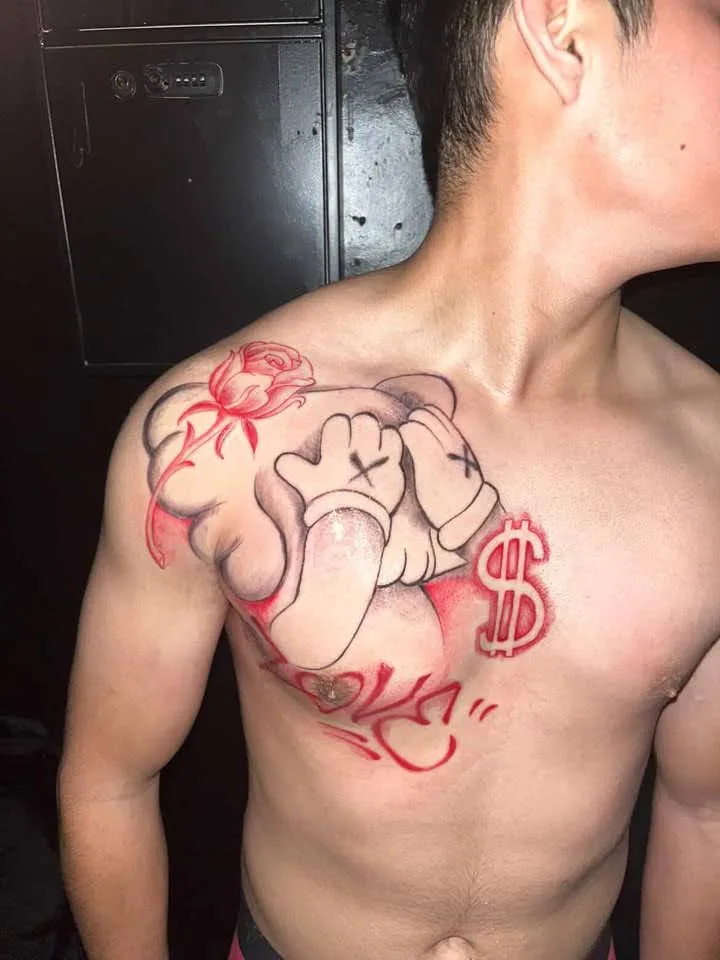 Red and black chest piece part way through a session